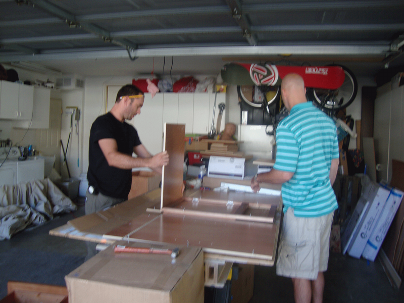 Instructing the carpenter on how to assemble the cabinets